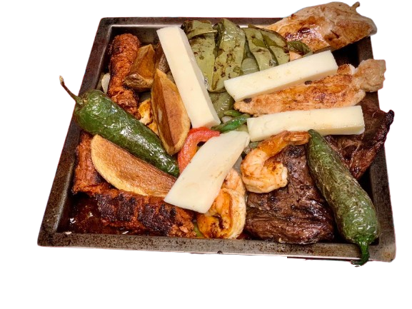 Traditional Mexican plate with grilled pork chop topped with mustard, served with grilled onions, flour tortilla, and a whole jalapeño pepper on a turquoise plate – from a Mexican restaurant in Chicago.