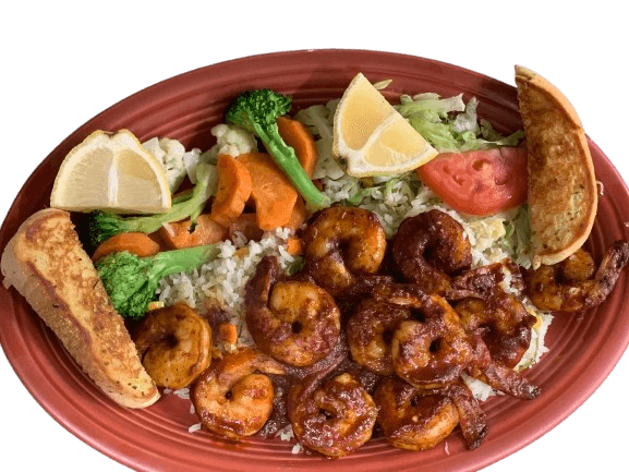 Delicious grilled shrimp served on a bed of seasoned rice with sautéed vegetables, lettuce, tomato, lemon wedges, and toasted bread – traditional Mexican-style seafood plate from a restaurant in Chicago.