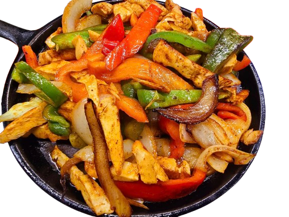 Skillet of sizzling chicken fajitas with grilled bell peppers, onions, and spices served at Pepe’s Mexican Restaurant.